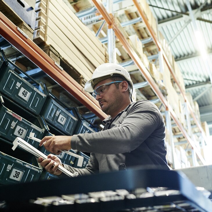 Employees in the small parts warehouse