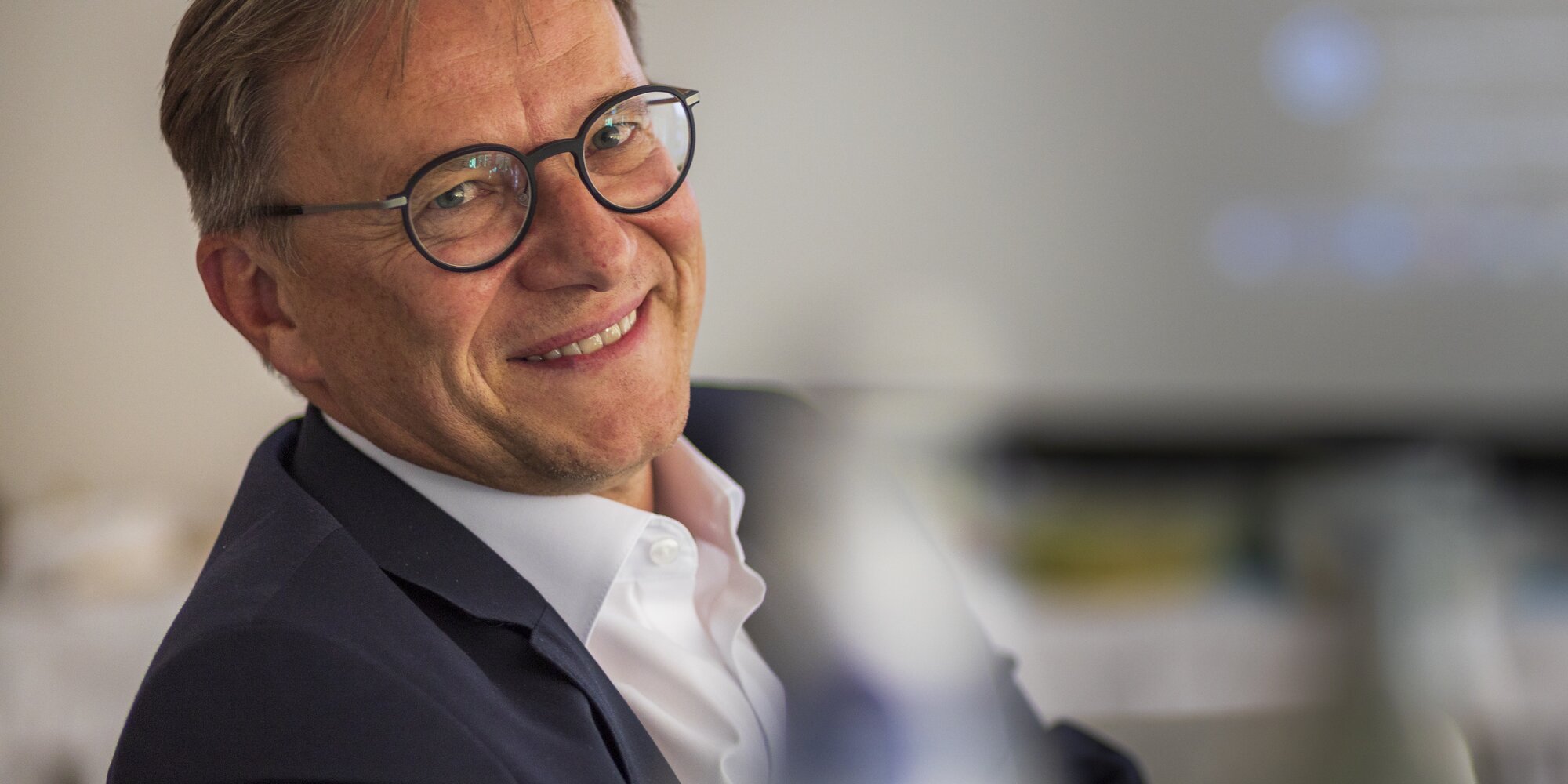 Laughing man in a suit