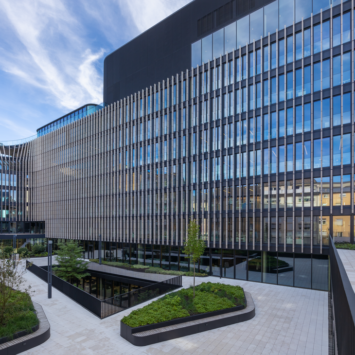 Modern façade of the Luxembourg Post building with green forecourt
